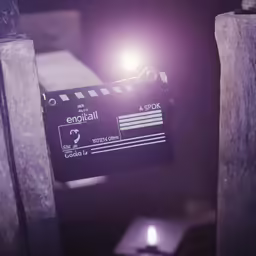 a digital camera and its lighted flash are on