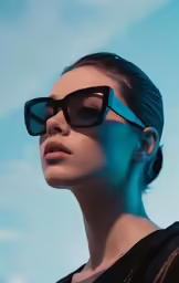 the woman in sunglasses has a blue light on her face