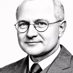 black and white photo of man with glasses looking at camera