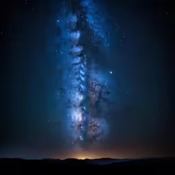 a bright blue and purple streak is seen over a mountain