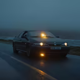 a car on a street with bright lights