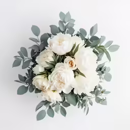 the flowers are arranged in white and green