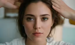 a woman is getting ready to take her own haircut
