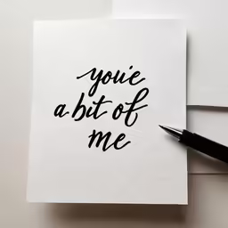 a pen resting on top of a piece of paper