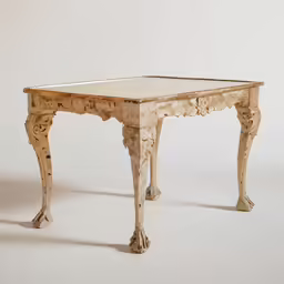 a small table with a carved edge that sits on white background