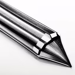 closeup image of a pointed pen writing