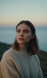 the model poses with her hand on her hip