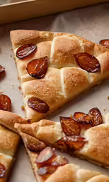 several slices of pizza sitting on top of paper