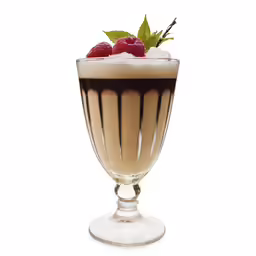 a tall glass filled with a beverage, topped with fresh berries