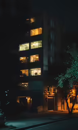 a couple of night time buildings are lit up at night
