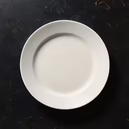 a plate that is sitting on a black table