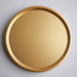 a gold plate sitting on top of a white surface