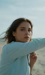 a woman is taking a selfie with a camera