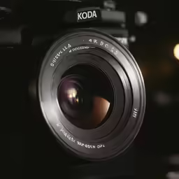 a black kodak camera on a table