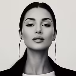a beautiful woman with long earrings on her head