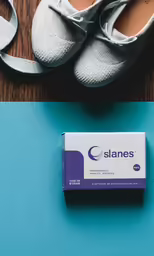 a box and pair of shoes next to them
