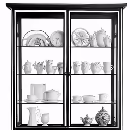 a collection of china, dishes and other things on a glass case