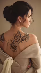 a woman with a tattoo on her back