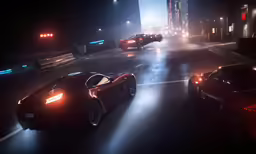 two very fancy looking sports cars on the road