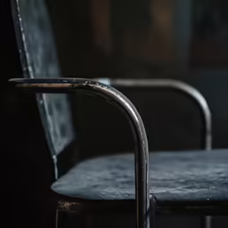 a chair that is in the dark with some paint