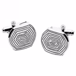 two cuff links that are shaped like they have a spiral design on them
