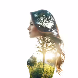the woman is looking down at the flowers