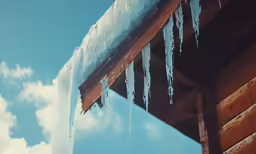 an ice and icicle hanging from the roof