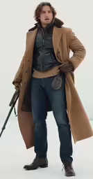 a man in winter clothing standing holding a gun