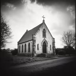 old church with its gothic style front door on a gray day