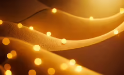 a close up of some lights in the sand