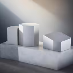 three shapes and two are stacked in a room