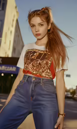 a girl with her hair in a ponytail wearing a shirt and jeans