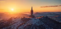 the sun shines over a mountain with a large clock tower