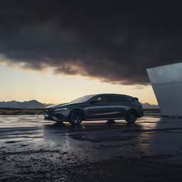 a car parked in front of a structure with a very dark cloud