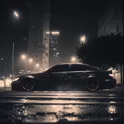 black car in the dark driving down the street