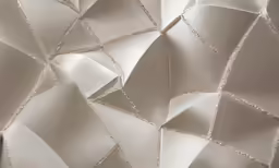 a close up of a white wall with diamond shapes