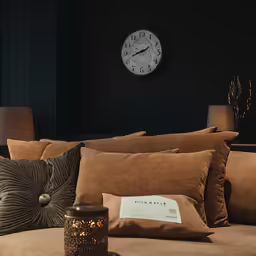 the pillows have been laid around a candle