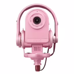 the pink camera is on top of a tripod