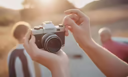 a person holding up a camera taking pictures