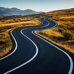 an empty road through a desert in the middle of nowhere