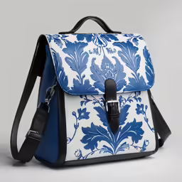 the blue and white backpack is shown on top of a gray surface