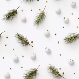 white eggs with some pine leaves on them