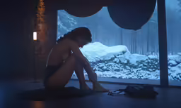 the person is sitting on the floor in the room