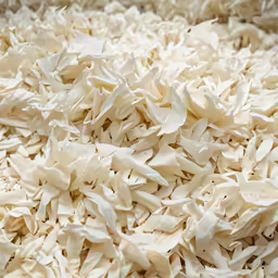 a close up view of rolled up chopped white rice