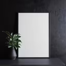 there is an empty picture frame with green plants in it