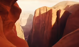 mountains in the desert with sunbeams in background