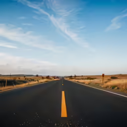 a highway stretching into the horizon on a clear day