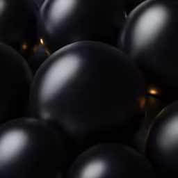 black spheres are arranged close together in this image