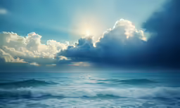 the sun shining through clouds over water and waves
