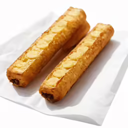 two pastry goods laying on top of each other